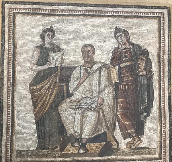 Mosaic of Virgil and the Muses (Clio [history, on left] and Melpomene [tradegy, on right]. 8th verse of Aeneid written on the volume. From the site of Soussa and currently in the Bardo Museum, Tunisia. Photo credit: Andrew G. Vaughn.