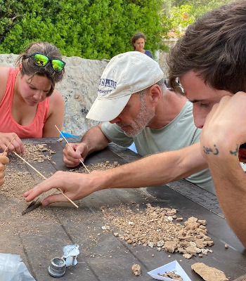 Kathleen Forste and members of the Menorca Archaeological Project sorting heavy fraction