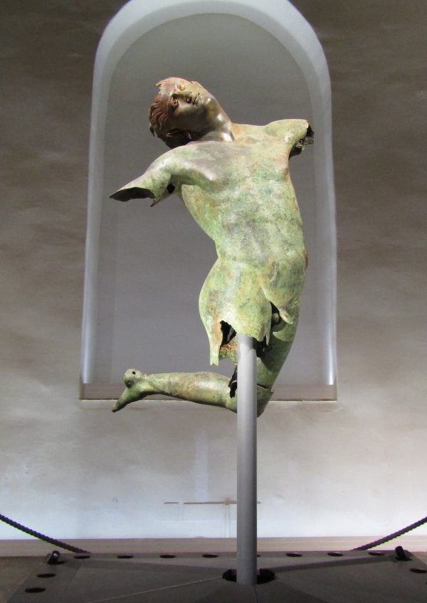 Fig. 6: The bronze statue of the dancing satyr, displayed in the Museo del Satiro Danzante in Mazara del Vallo, Sicily. This large-scale sculpture was found in the sea off Sicily as an isolated find, out of archaeological context. ©Katerina Velentza.