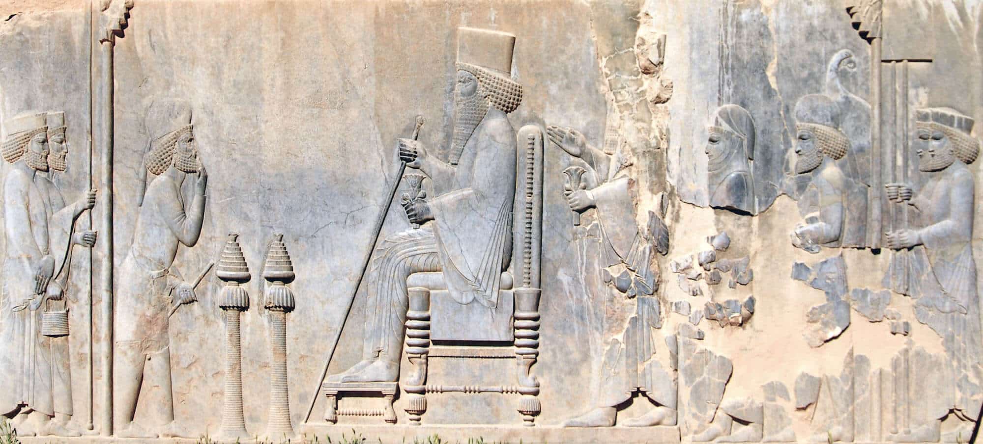 The Audience Scene on the Persepolis Treasury: The Great King (Darius I or Xerxes I) is sitting on the throne while holding a long scepter in his right hand