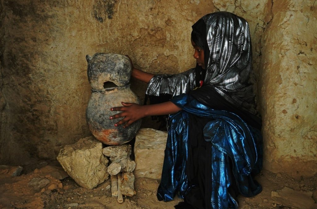 A girl from Ghat cooking couscous