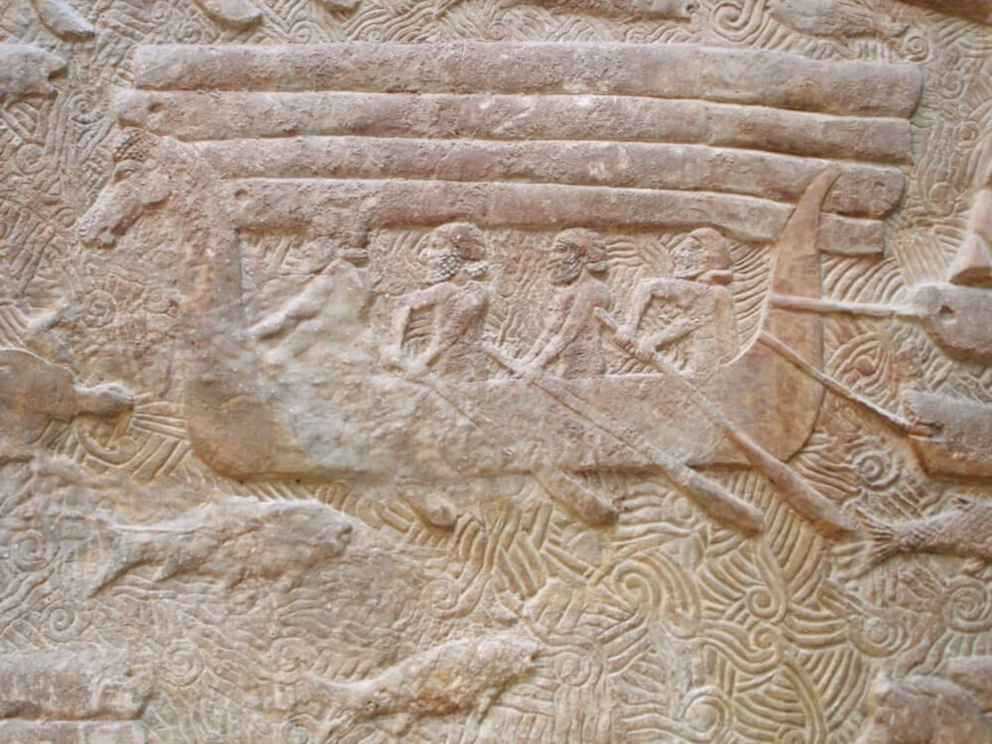 Fig. 6: Detail from a relief from the palace of Sargon II (722–705 BCE) at Dur Sharrukin, showing the transport of Lebanese cedars in boats with horse-headed prows. Photo: Public Domain.