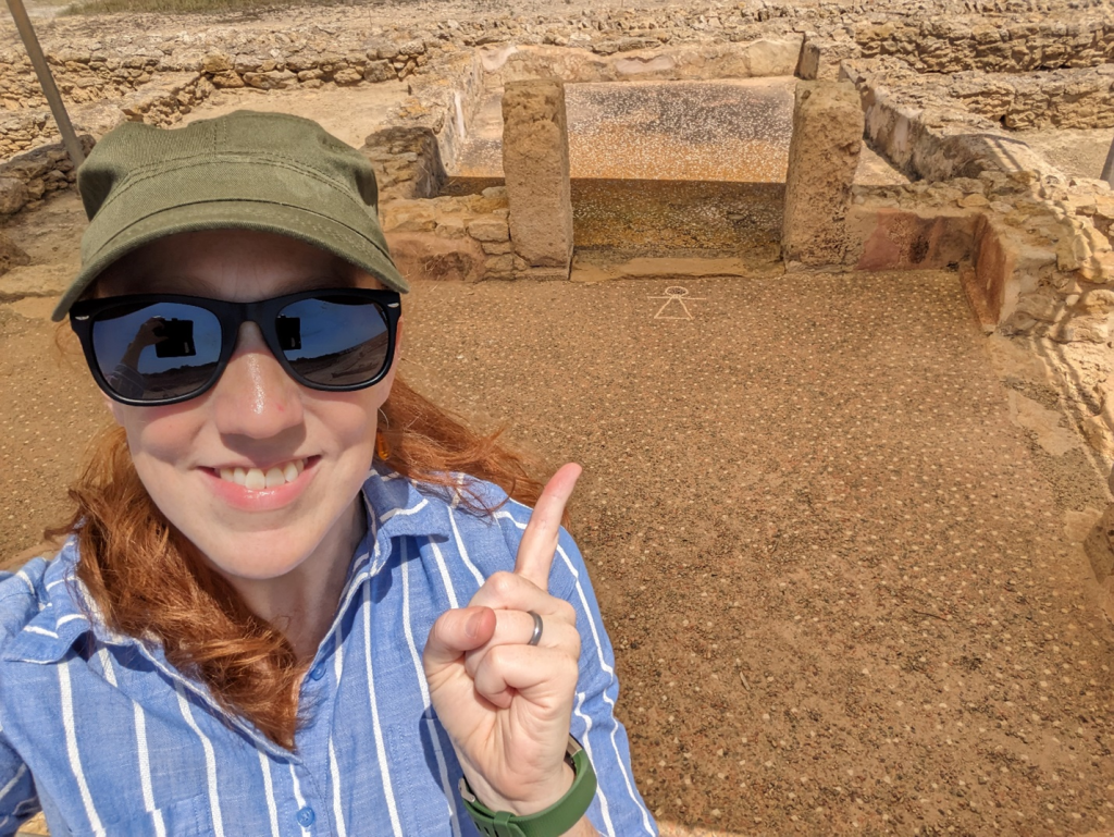 A visit to the mosaic “Sign of Tanit” in the floor of a private home (ca. 250 BCE), preserved at the incredible Kerkouane archaeological site (photo by H. Dixon).