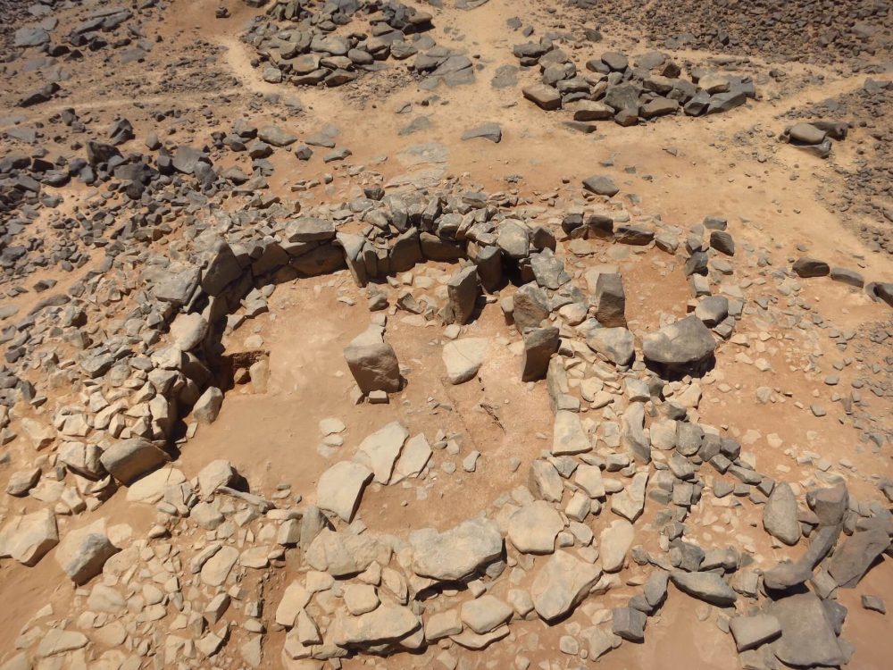 Figure 5: Partially excavated building (W80) at Wisad Pools, with upright central pillar, exterior areas, and partially blocked door at bottom left. Photo by Y. M. Rowan.