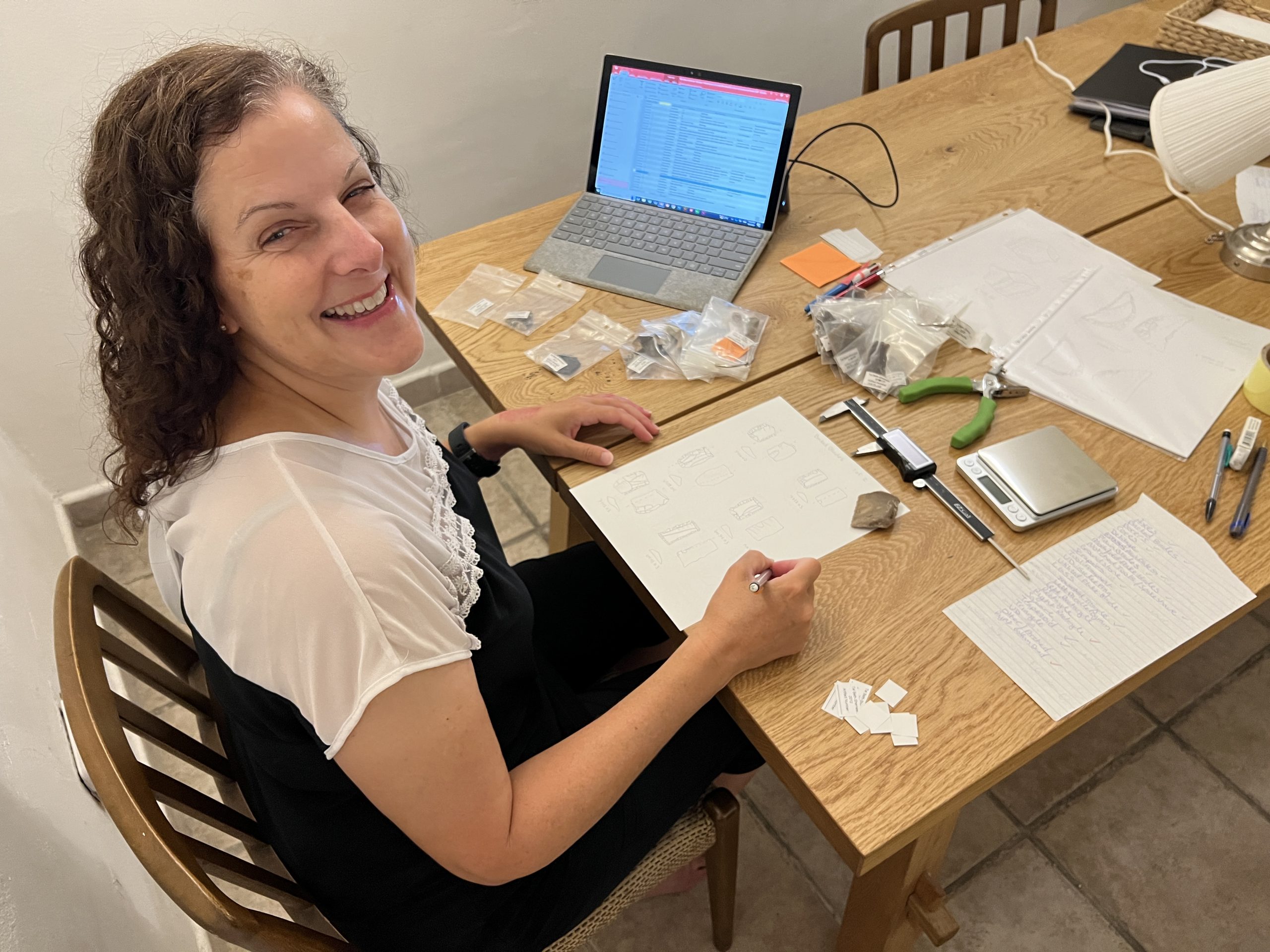 Shawn Bubel drawing chipped stone artifacts excavated from Tel Beth-Shemesh.