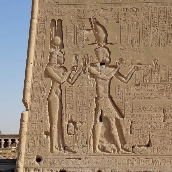 Cleopatra dressed as Hathor with her son Caesarion pay homage to the gods. Relief on the temple at Dendera, Egypt (Photo: Olaf Tausch via Wikimedia Commons, CC BY 3.0 DEED. Photo has been cropped).