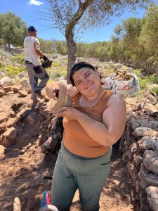 Emma Wagner excavating with the Menorca Archaeological Project in Spain.