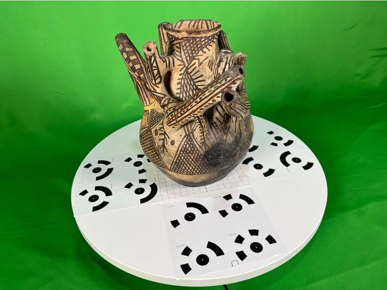 A cruche (jug) from the Bardo Museum in Algiers being prepared for 3D photogrammetry. This early 20th century pottery piece from the Cheliff region of western Algeria has eight spouts. Curators posit it could have been used for ceremonial or decorative purposes with its complex design suggesting symbolic significance. Photo © Peter Herdrich