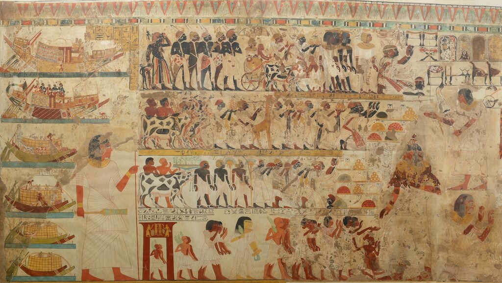 Rulers of Nubia accompanied by their entourage present gifts and pay homage to the Pharaoh. Tomb of Huy (TT40), ca. 1353–1527. Facsimile painting by Charles K. Wilkinson. Metropolitan Museum of Art 30.4.21. Public Domain.