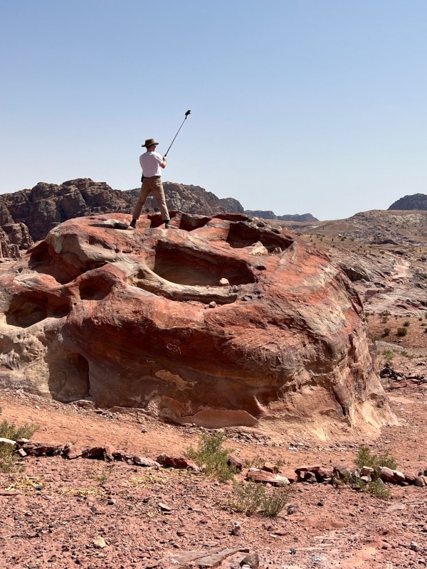 Figure 4 Josh Feland carrying out photogrammetry of funerary features in Petra.