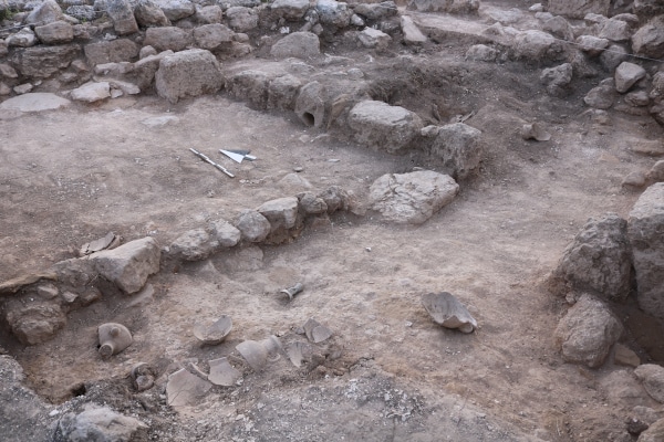 Excavation area showing crushed pottery in place. Photo credit Bethany Walker.