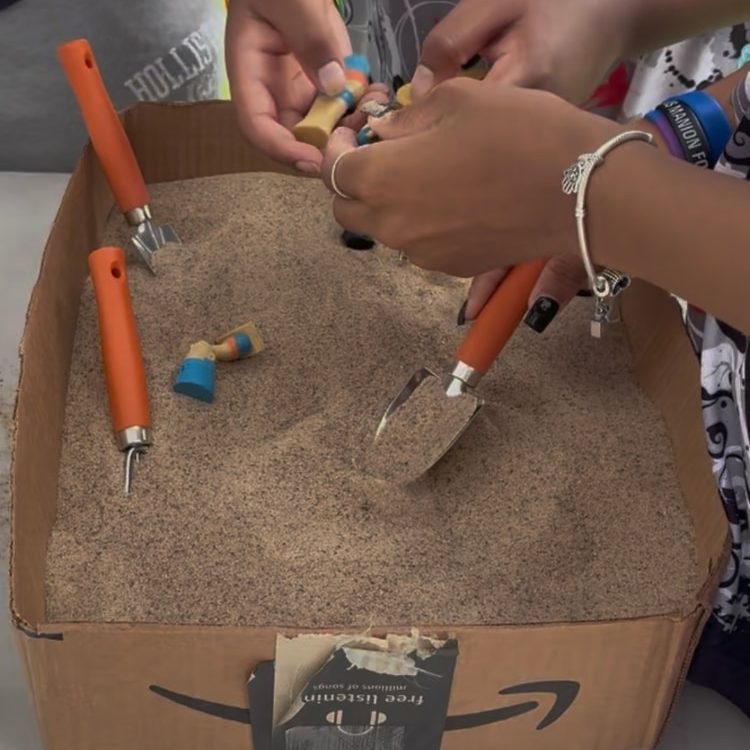 Young archaeologists excavating for artifacts