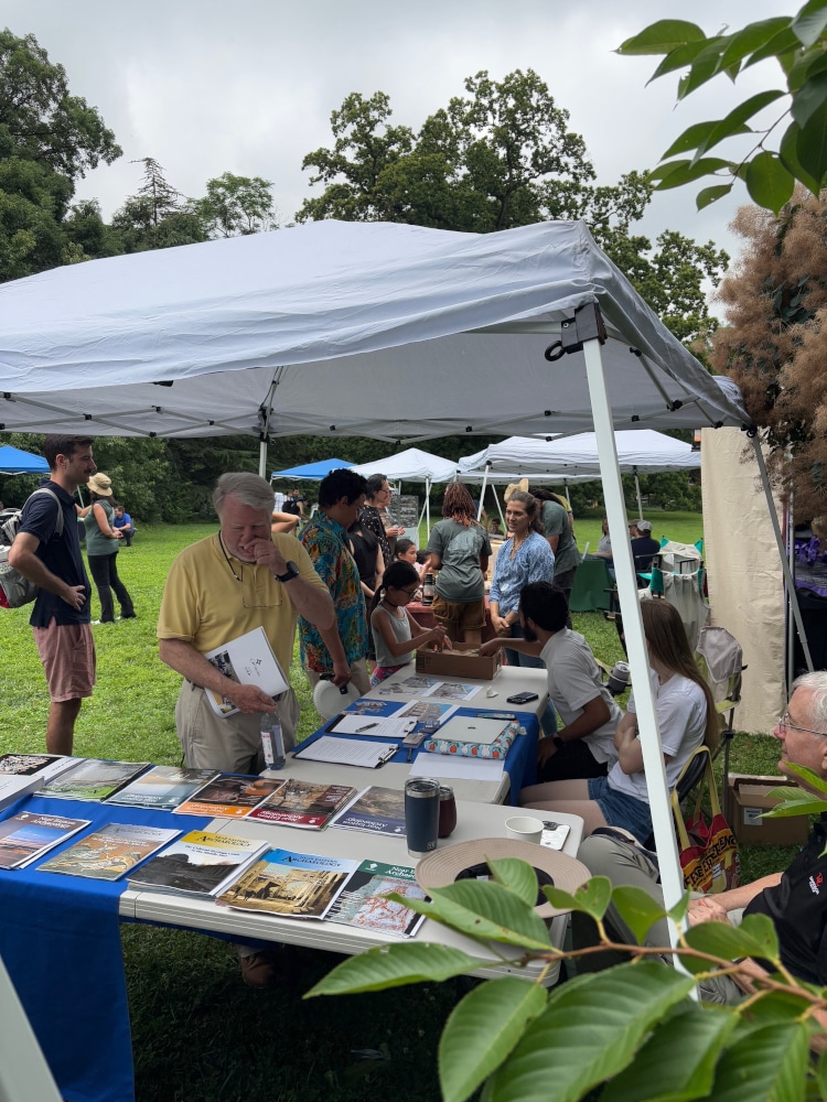Attendees browsing the ASOR table