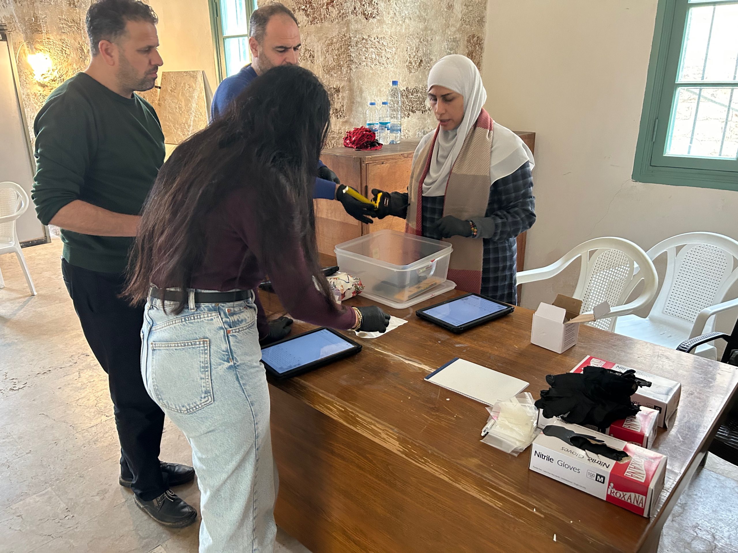 Workshop participants practice recording objects during a mock scenario on cultural property seizure (Credit: ASOR).