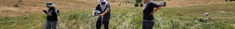 Fig. 3: Teaching field school students how to survey in one of the few remaining soft patches of ground.